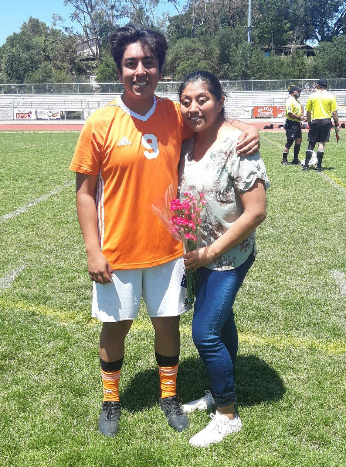 Jimmy Claudio poses for a photo with his mom, Imer Amador, at an Atascadero High School soccer game.