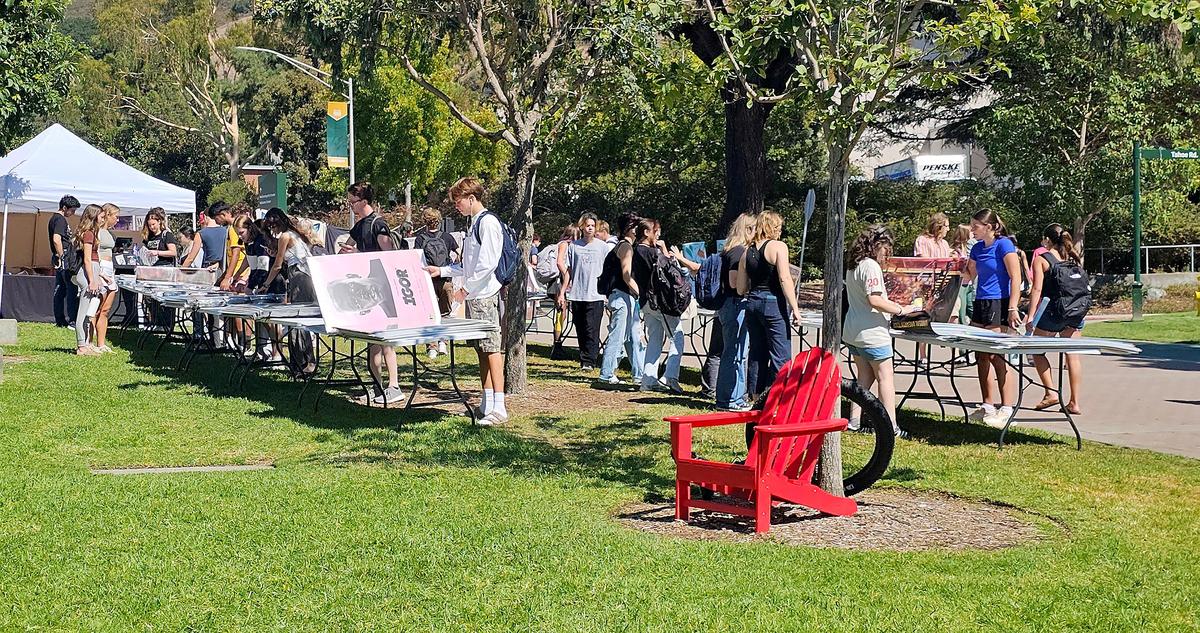 Students look at posters for sale at Cal Poly’s University Union Plaza.