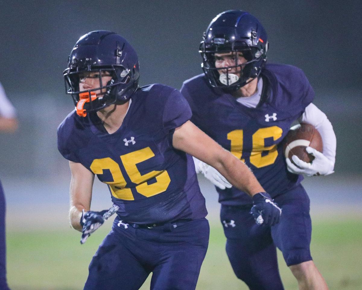 Junior Herlihy blocks for Koa Kopcho. Arroyo Grande fell 39-7 loss to Centennial of Bakersfield on Aug. 26, 2022.