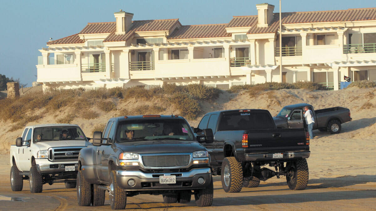 A steady flow of traffic enters and exits the Oceano Dunes at the Pier Ave.  Ramp in Oceano.  7-24-08 David Middlecamp