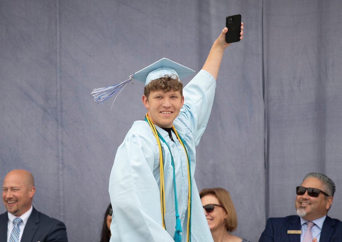 Central Coast New Tech High School held its graduation ceremony on June 8, 2024. Wyatt Buley takes a selfie on stage.