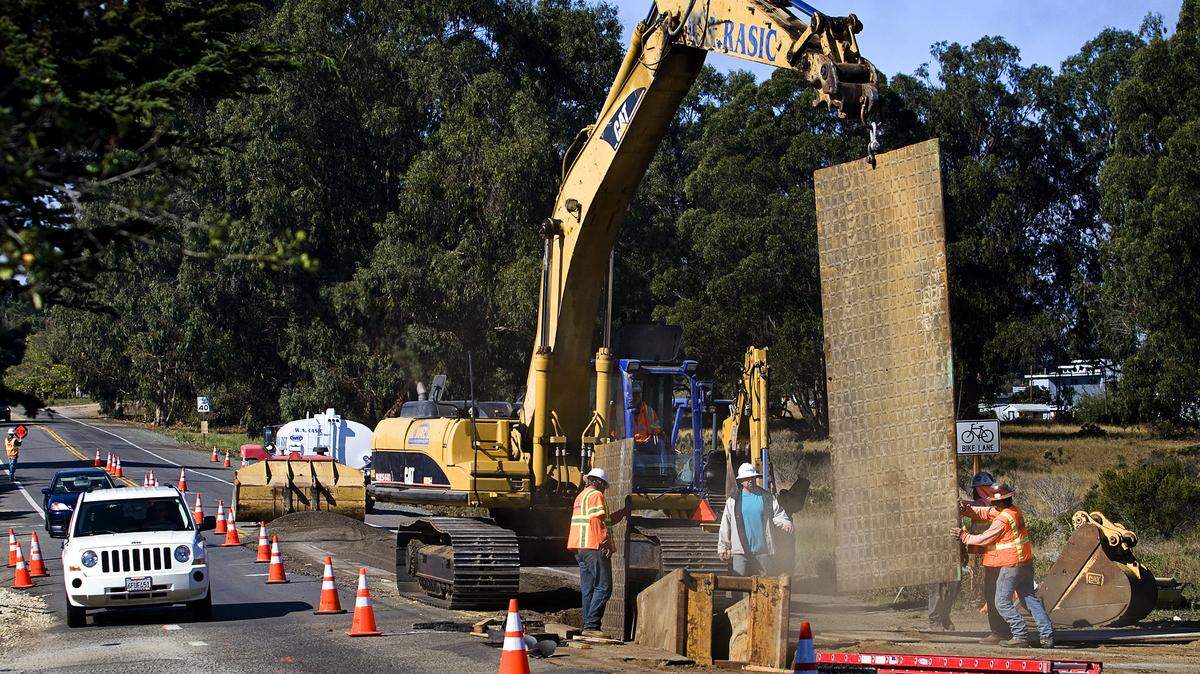 Crews work on installing sewer lines along Los Osos Valley Road in Los Osos in October 2012. In March 2013, crews uncovered a Chumash burial site. The exact location of the discovery is not being disclosed in order to protect the site from looting.