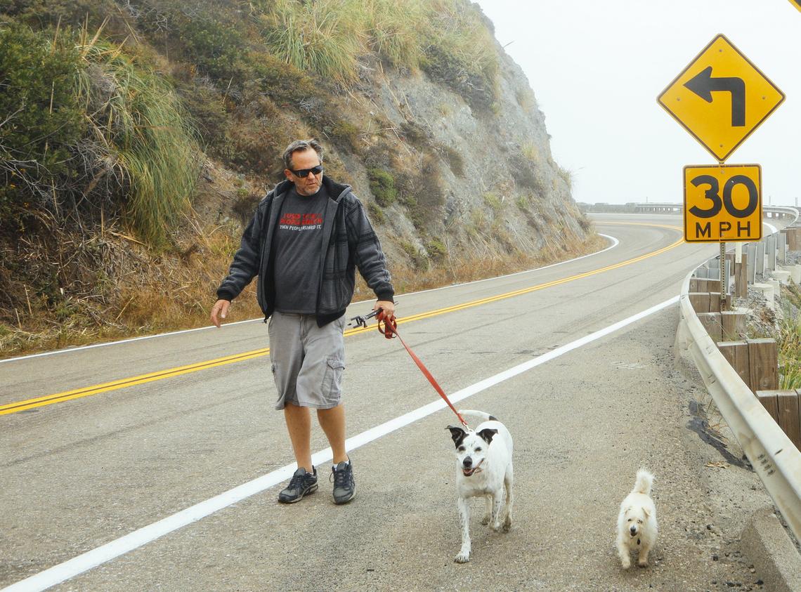 Steve Mack and his dogs Sadie and Scooter were excited about the newly opened section of Hwy. 1 across the Mud Creek Slide Wednesday morning.