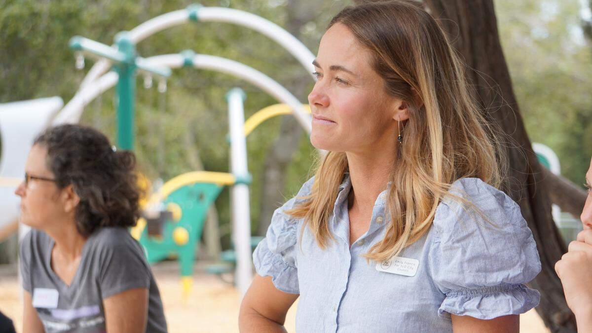 SLO City Council candidate Emily Francis listens to an attendee of the YIMBY candidate forum on housing.