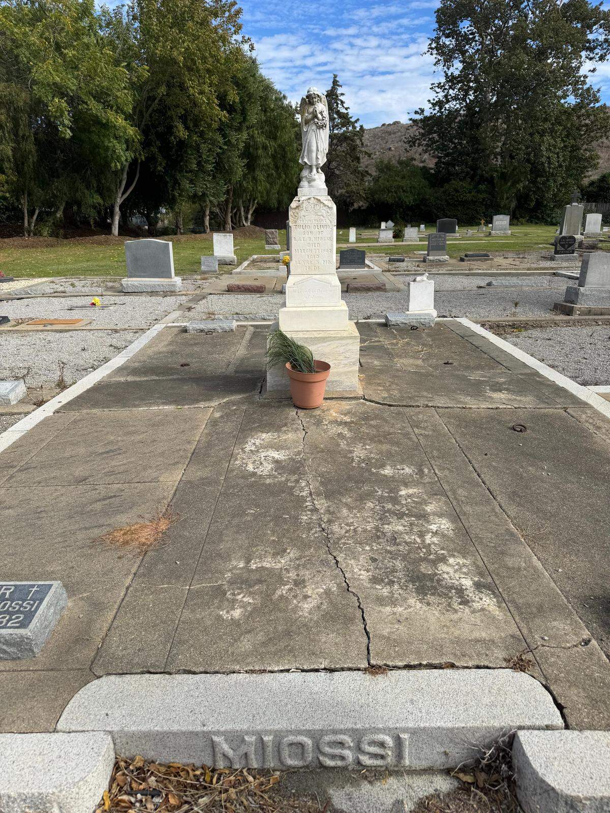 An obelisk for 5-month-old child Tulio Olivio Miossi features a statue of an angel praying over the grave site. It’s seen on Oct. 25, 2025, in Old Mission Cemetery in San Luis Obispo.