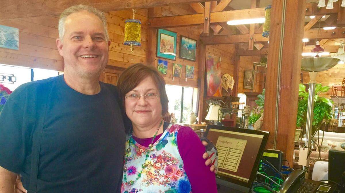 Phil Gardner, left, and Andrea Bowen-Gardner pose inside their San Luis Obispo consignment shop Timeless Treasures.