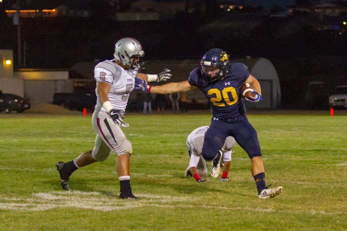 Arroyo Grande High SChool senior running back James Gilmet carries the ball in a non-conference football game Friday against Nipomo.