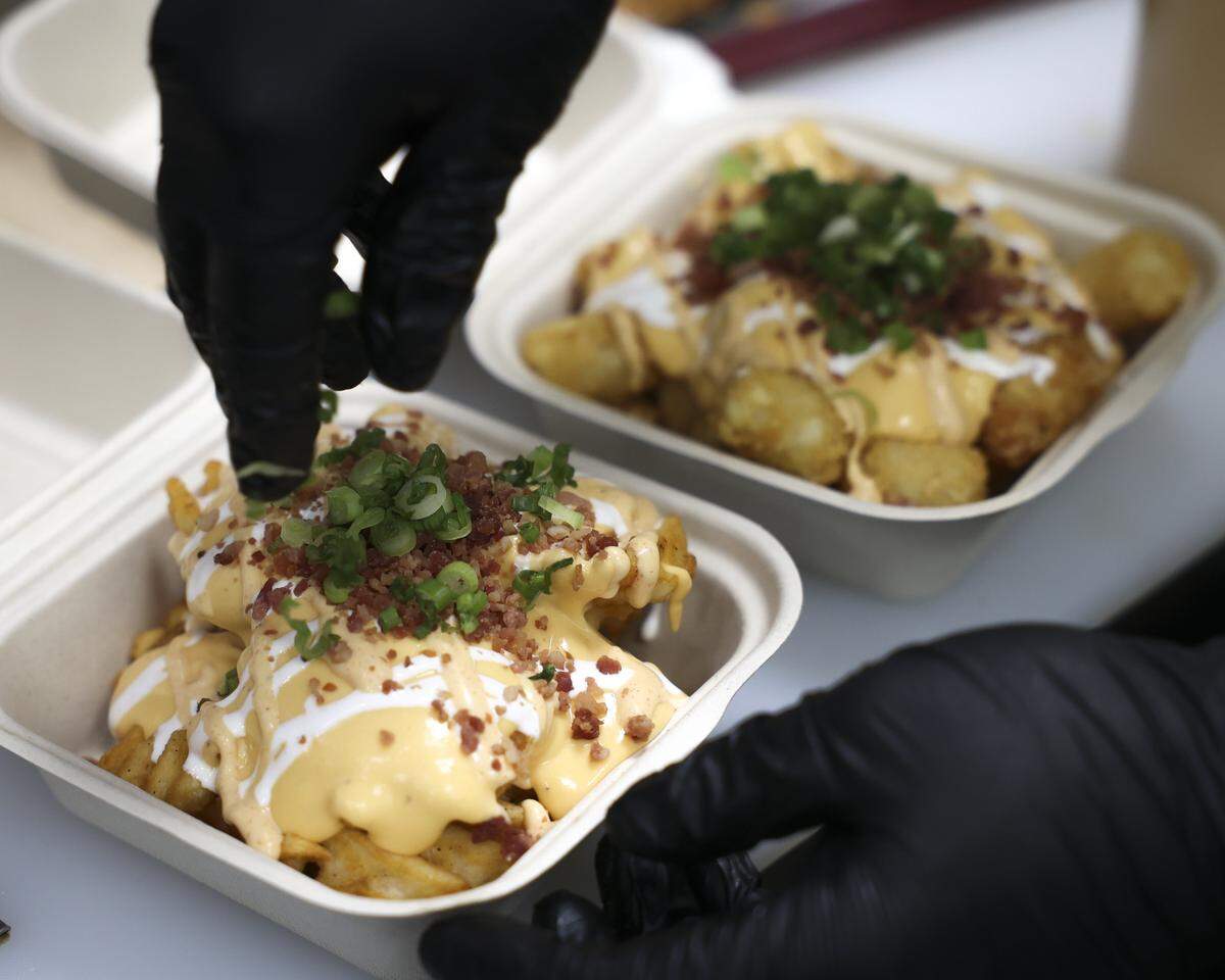 Loaded tater tots and waffle cut fries at Woodstone Chicken & Waffle House, a new restaurant on Foothill Blvd. near California Fresh as seen on Jan. 29, 2026.