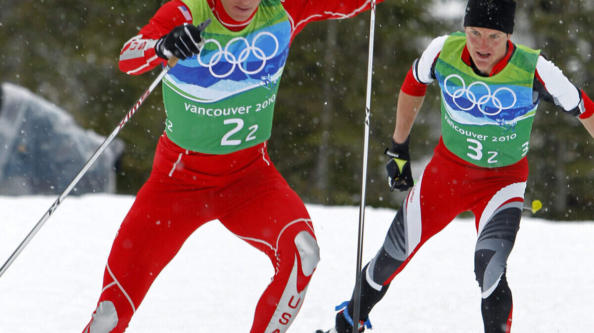 Todd Lodwick of the U.S. keeps ahead of David Kreiner of Austria during the nordic combined team event. (Erich Schlegel/MCT)