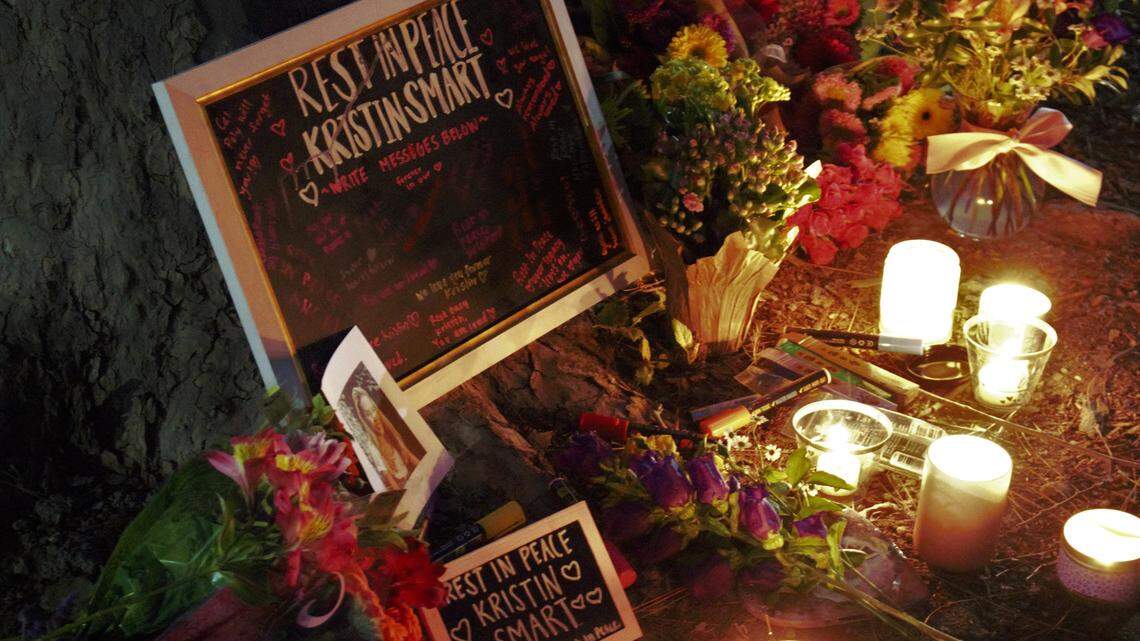 Cal Poly students laid out flowers, lit candles, burned essence and wrote well-wishing notes on a chalkboard to Kristin Smart and her family during a candlelight vigil Tuesday evening. Students said they wanted to pay their respects to Smart and honor her memory on the day that Paul Flores was arrested on suspicion of the former university student’s murder.