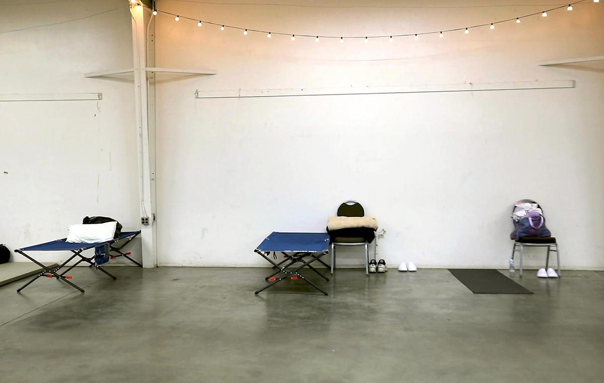 Cots and blankets, food and warm clothing were provided to homeless people spending the night at a warming center set up at the Paso Robles Event Center on Tuesday, Jan. 17, 2023. Local nonprofits partnered with the county to open a temporary North County shelter for unhoused people during the storm.