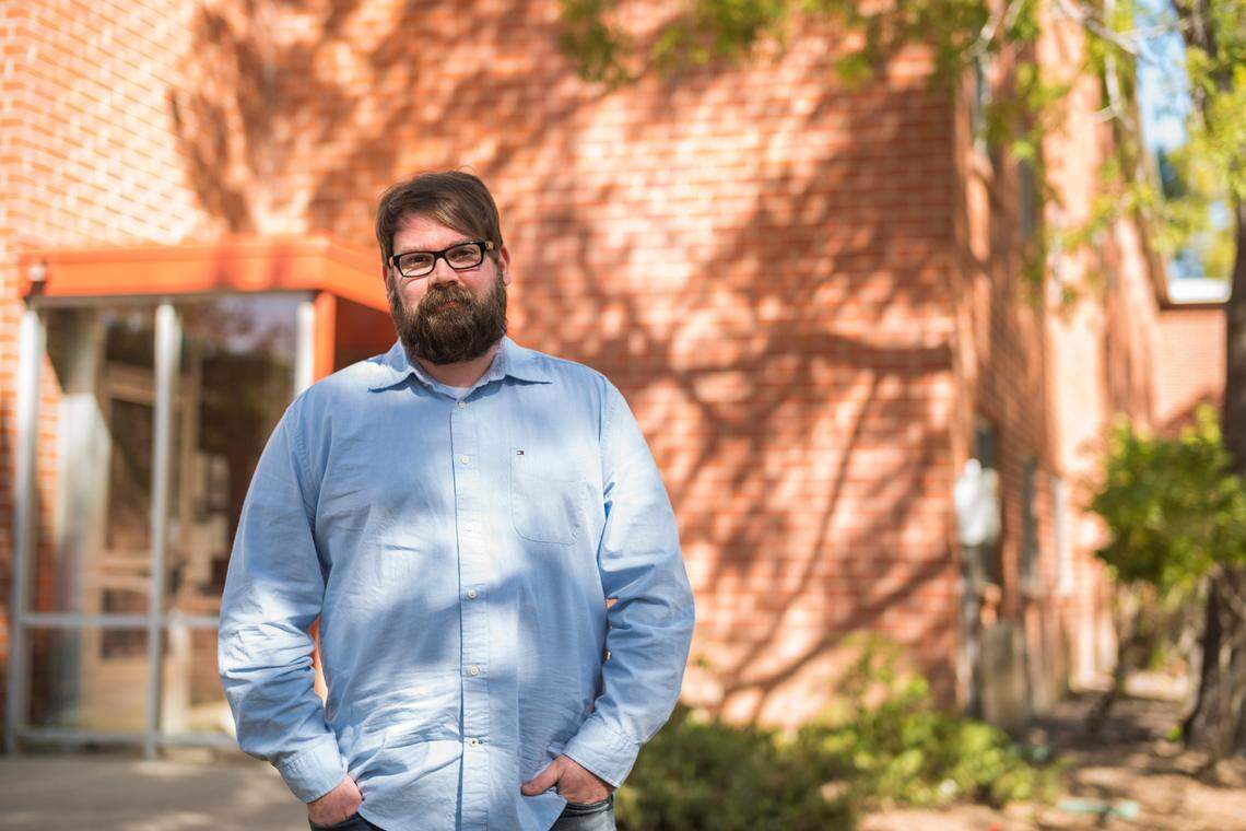 Chris Lambert, an Orcutt musician and recording engineer, poses Thursday, April 15, 2021, in front of Muir Hall dormitory at Cal Poly in San Luis Obispo. Lambert started a podcast to document the 1996 disappearance of Kristin Smart, who was a college student at Cal Poly and lived in Muir Hall when she disappeared.