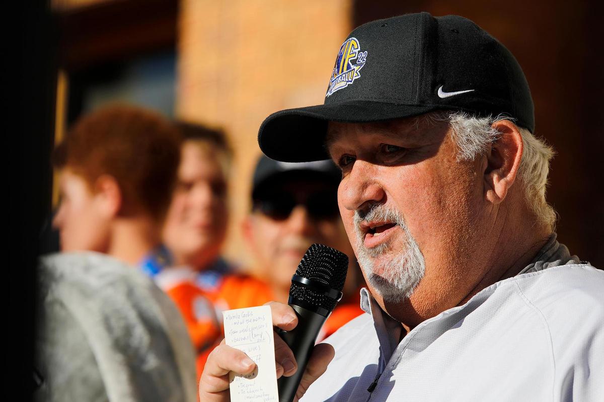 Atascadero High School football Coach Vic Cooper tears up a little when speaking about the coaches’ wives and his own wife making sacrifices during the Greyhounds’ historic championship season, during a parade to City Hall on Wednesday, Dec. 21, 2022.