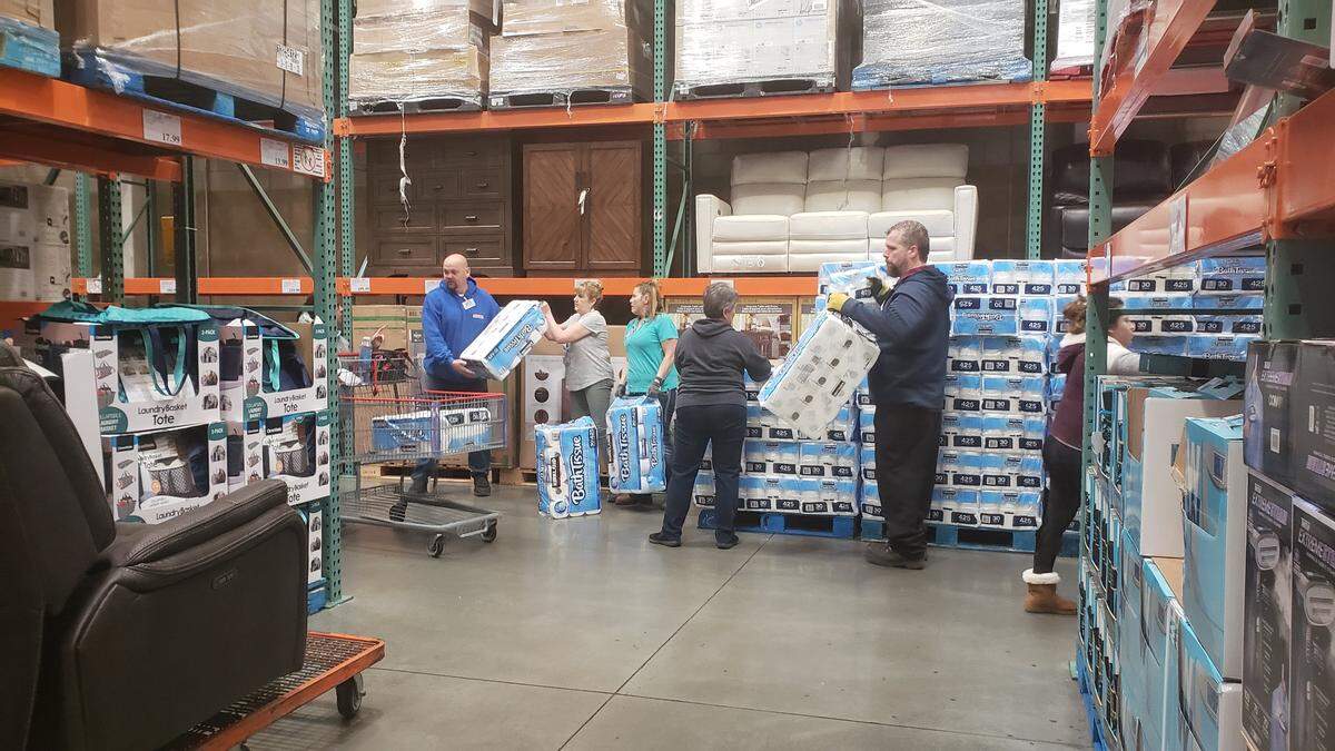 Costco shoppers were given one package of toilet paper per membership and directed through a line Saturday morning.