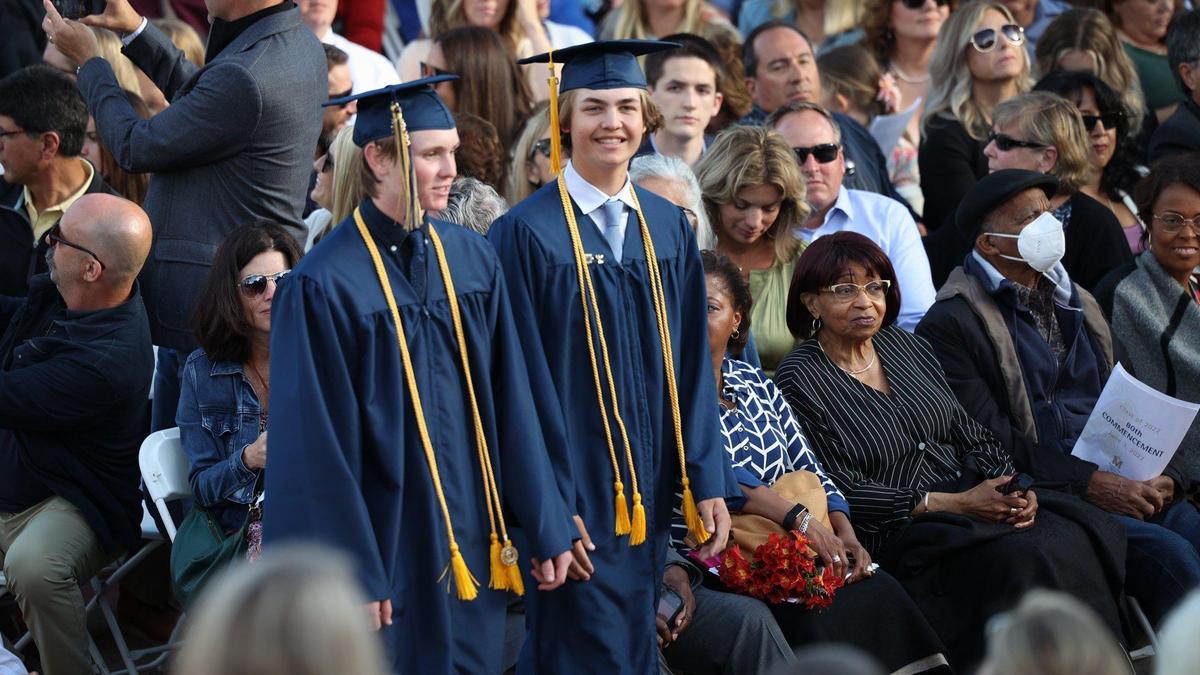 Ryan Kasper and Jack Ozmina walk past friends and family as Mission College Preparatory Catholic High School graduated on the steps of Mission San Luis Obispo June 3, 2022.