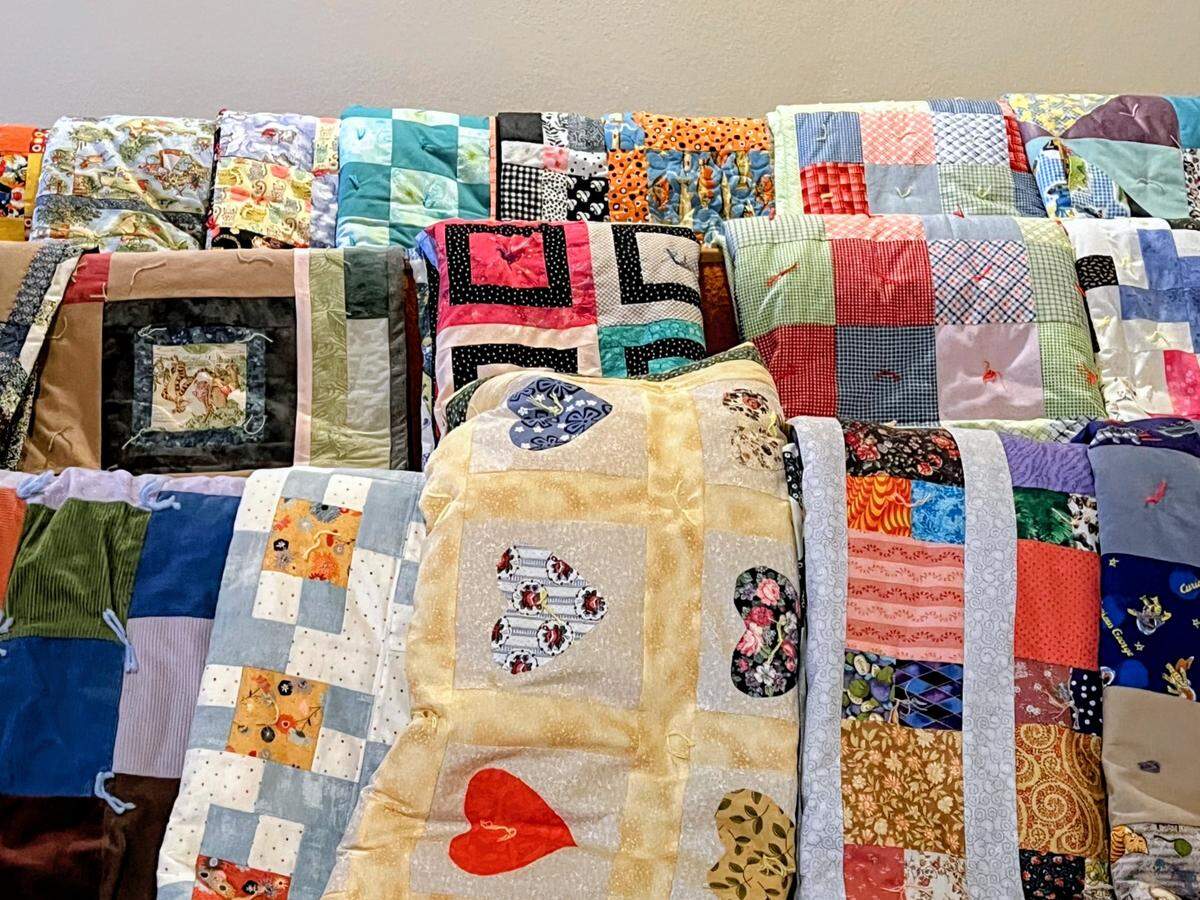 Members of the Lutheran Women’s Missionary League create quilts for foster children attending summer camp. Zimmerman participates in the volunteer effort.