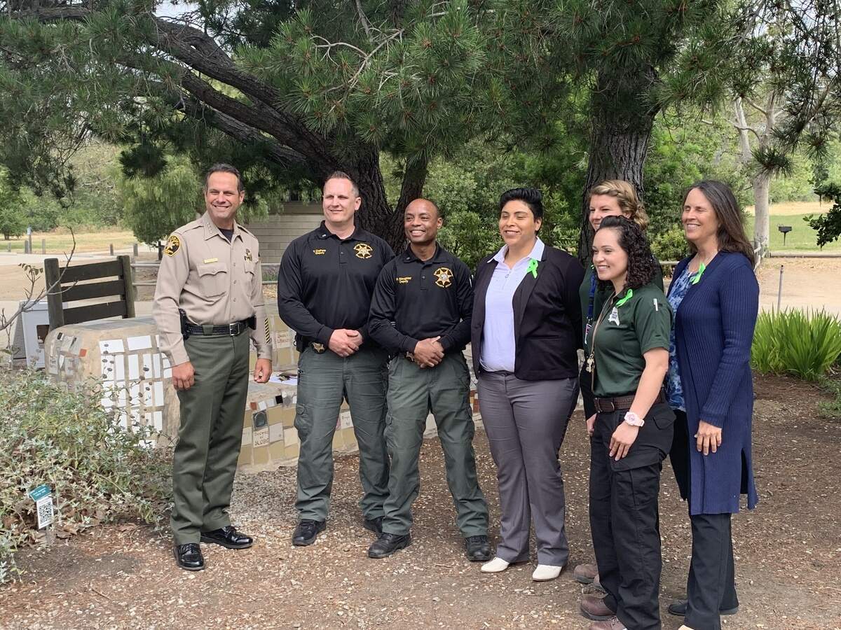 San Luis Obispo County Sheriff Ian Parkinson, far left, with members of the new joint Sheriff’s Office and Behavioral Health Department Community Action Team at El Chorro Regional Park Wednesday morning. Behavioral Health Director Anne Robin is at far right.