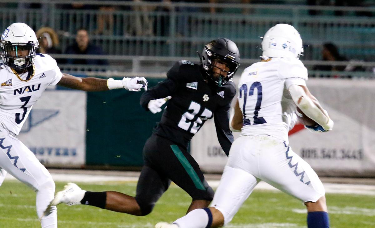 Cal Poly’s Christian Middleton (22) tracks down Northern Arizona’s Kevin Daniels (22). In its season finale, Cal Poly fell to Northern Arizona 45-21 at Alex G. Spanos Stadium in San Luis Obispo, on Saturday, Nov. 20, 2021.