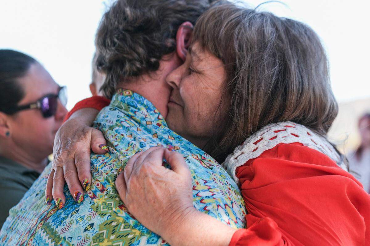 Melody Pinion hugs a loved one at her son Todd’s memorial in Santa Margarita on Nov. 9, 2024. Todd Pinion was killed in an alleged hate crime on Oct. 23, 2024.