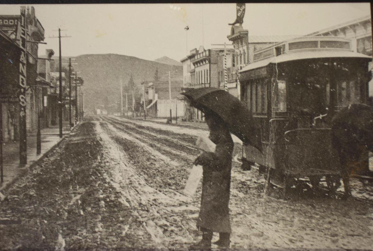 This scene south on Higuera Street at about Chorro Street distributed by the Morning Tribune in postcard size to its readers on Jan 1, 1890. San Luis Street Railway pulled by horse is at right while carrier makes his way across a mud street. The Tribune, and all other newspapers published here in earlier years, frequently complained about the mud in winter and the dust in summer.