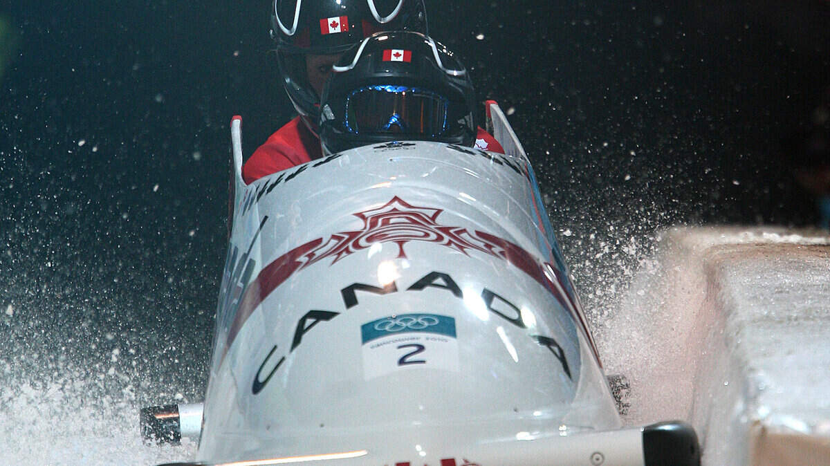 Canada's Kaillie Humphries and Heather Moyse complete their gold-medal run in the women's two-man bobsleigh event. (Peter J. Thompson/Canwest News Service/MCT)