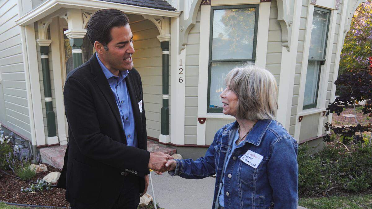 Jimmy Paulding, who’s running to represent District 4 on the San Luis Obispo County Board of Supervisors, greets Kathie LaMartin at an election night party at Heritage House in Arroyo Grande on Tuesday, June 7, 2022