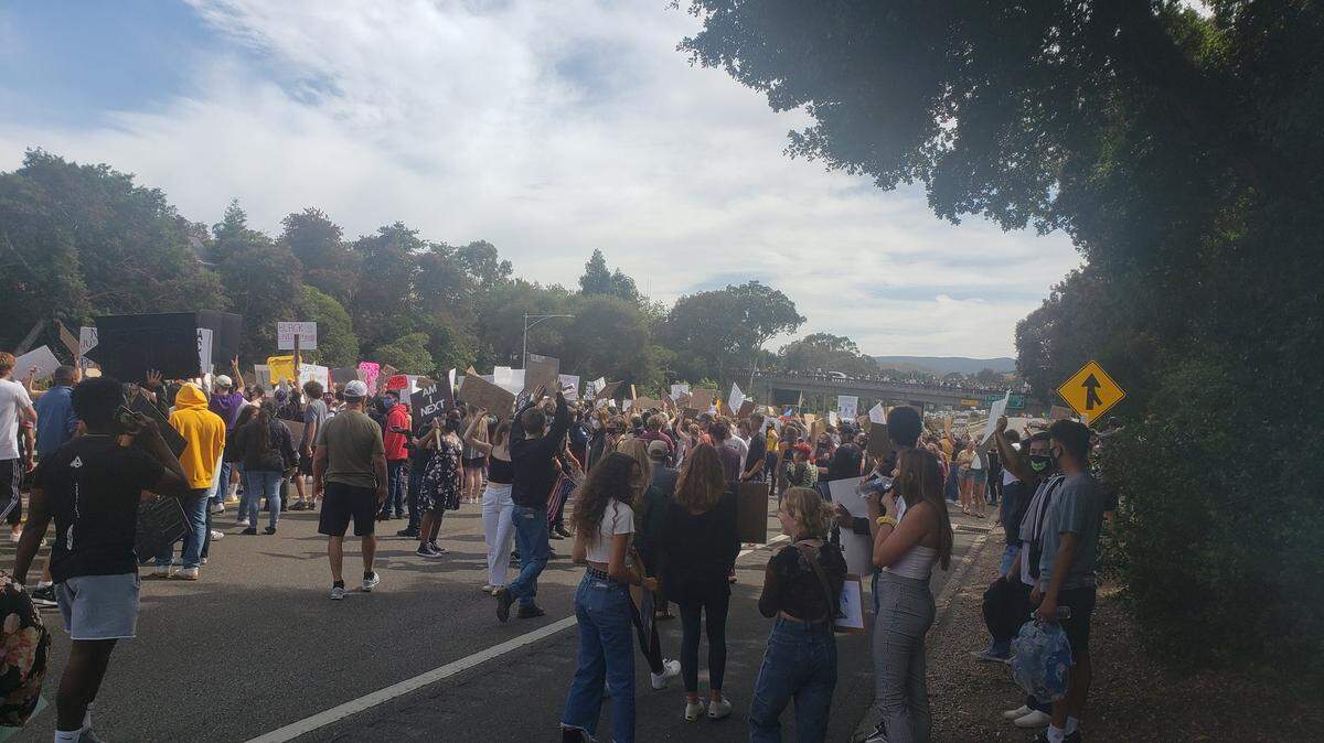 Protesters march on Highway 101 in San Luis Obispo on Monday, June 1, 2020.