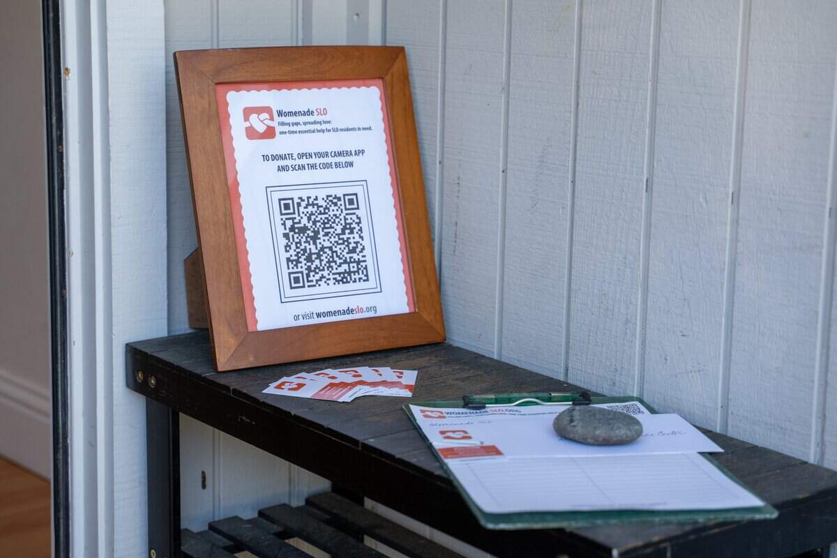 Signup information for Womenade SLO sits outside of executive director Elaine Stewart's home in San Luis Obispo on Saturday, Dec. 6, 2025. Womenade SLO was founded in April 2025 as a successor to the Womenade organization that served San Luis Obispo County from 2003 to 2019.
