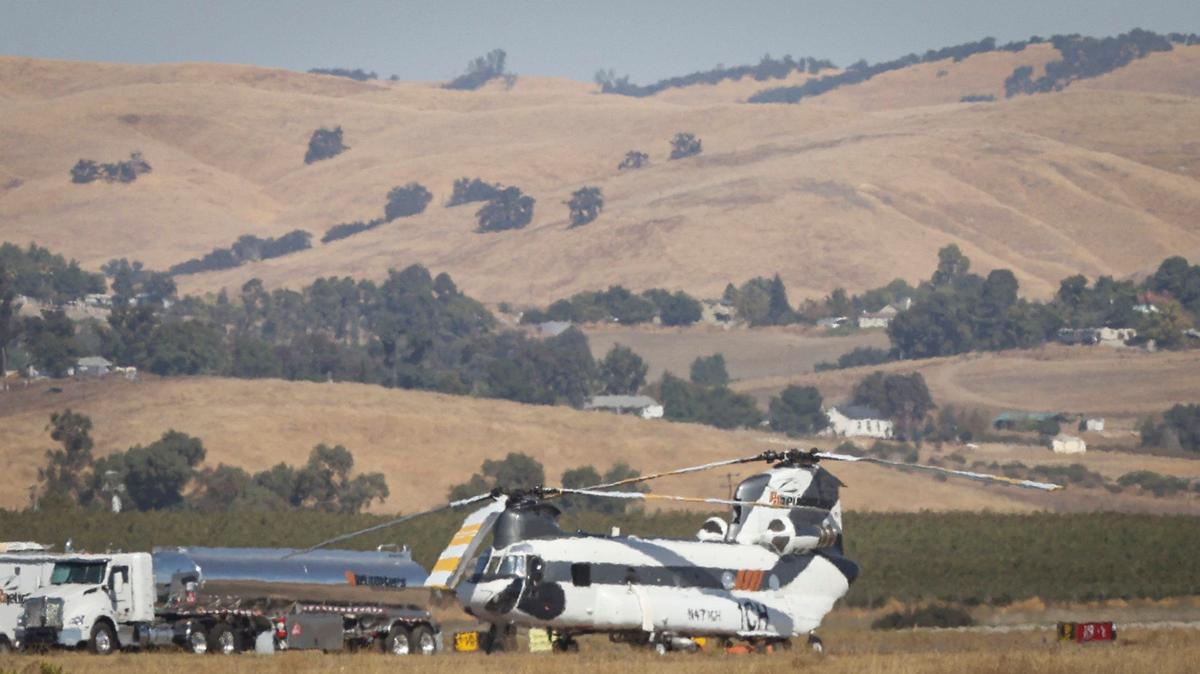 A twin rotor helicopter shimmers in the heat at the Paso Robles Municipal Airport, where the city records its daily temperatures. Paso Robles set heat records for six consecutive days from Oct. 1 to Oct. 6, 2024.