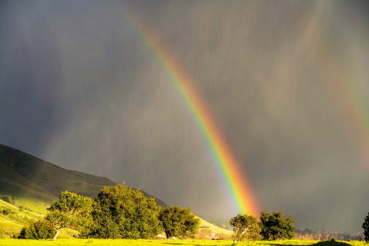 A rainbow appeared during Thursday’s sudden hail storm in San Luis Obispo in this view from Terrace Hill.