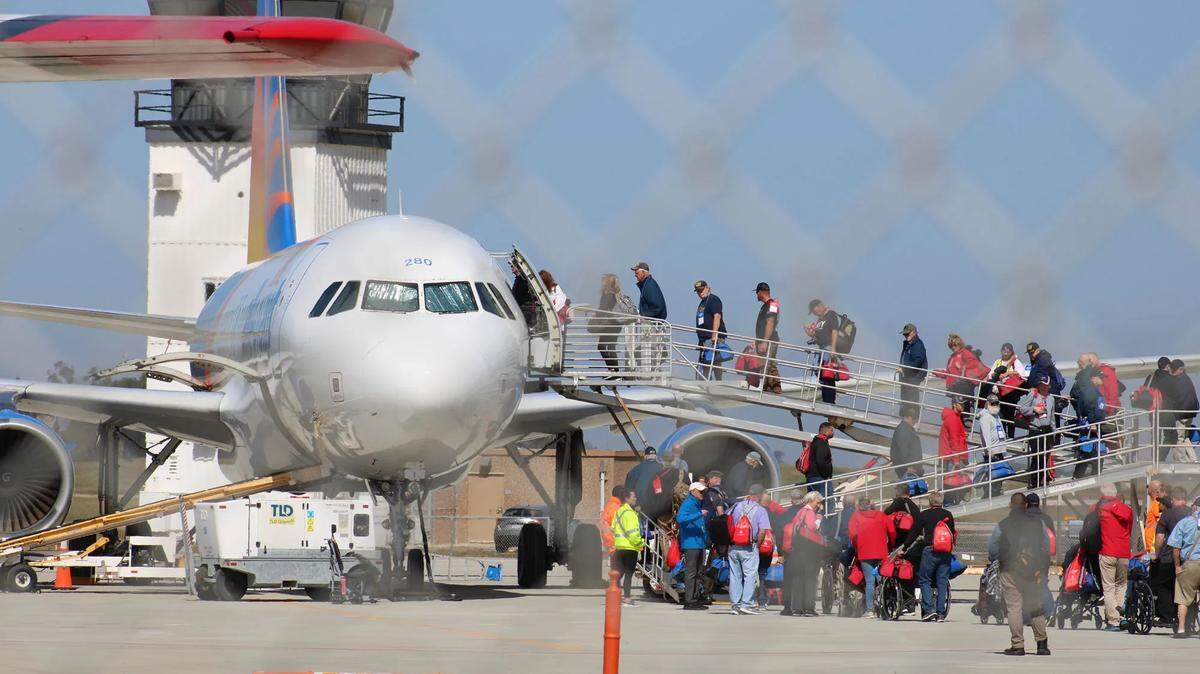 Honor Flight of the Central Coast participants board an Allegiant Air charter plane on Monday, April 24, 2023, for a whirlwind tour of memorials in Washington, D.C. They will return Wednesday night.