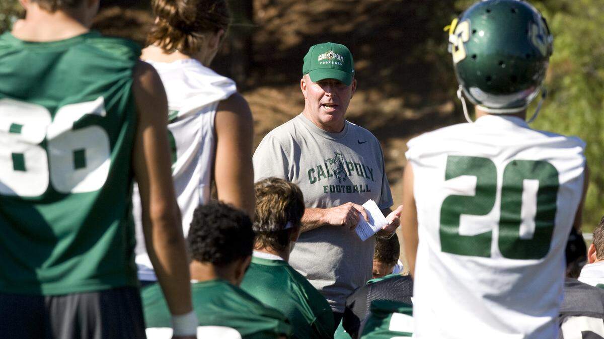 Cal Poly football head coach Tim Walsh talks to players Tuesday about how they should prepare for the upcoming season after the second practice since an off-campus incident Sunday that led to the arrests of five players on the team.
