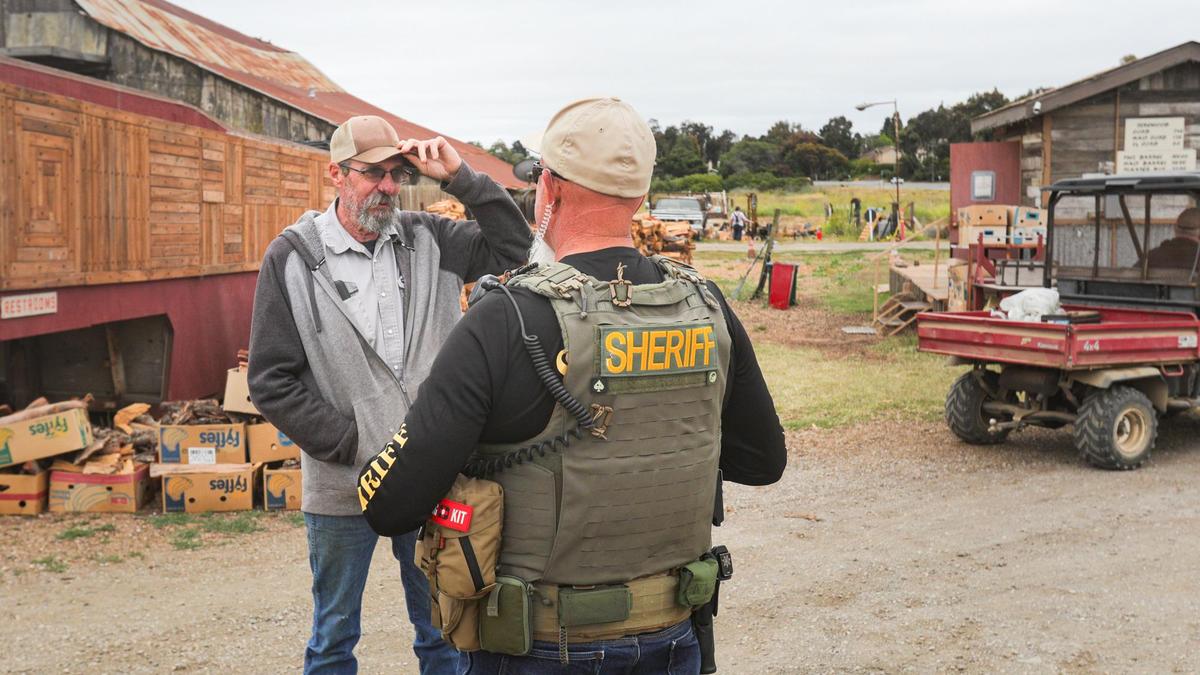 David Dieter, construction manager at Sunny Acres, talks to a sheriff’s deputy who had questions about the facility. County code enforcement officers and other officials inspect Dan DeVaul’s sober-living facility just outside San Luis Obispo on Wednesday morning, June 23, 2021.