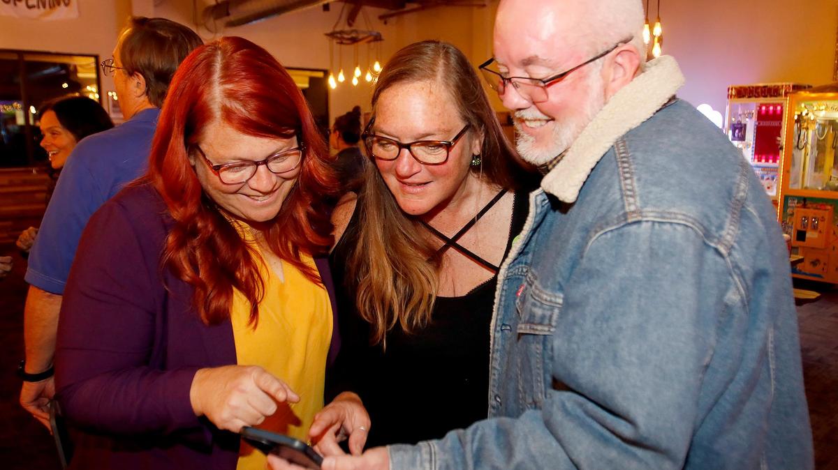 Atascadero City Council candidate Tori Keen joins Roni De Coster, center, and Matt Pennon at an election night party at Wild Fields Brewhouse in Atascadero on Election Night, Nov. 5, 2024.
