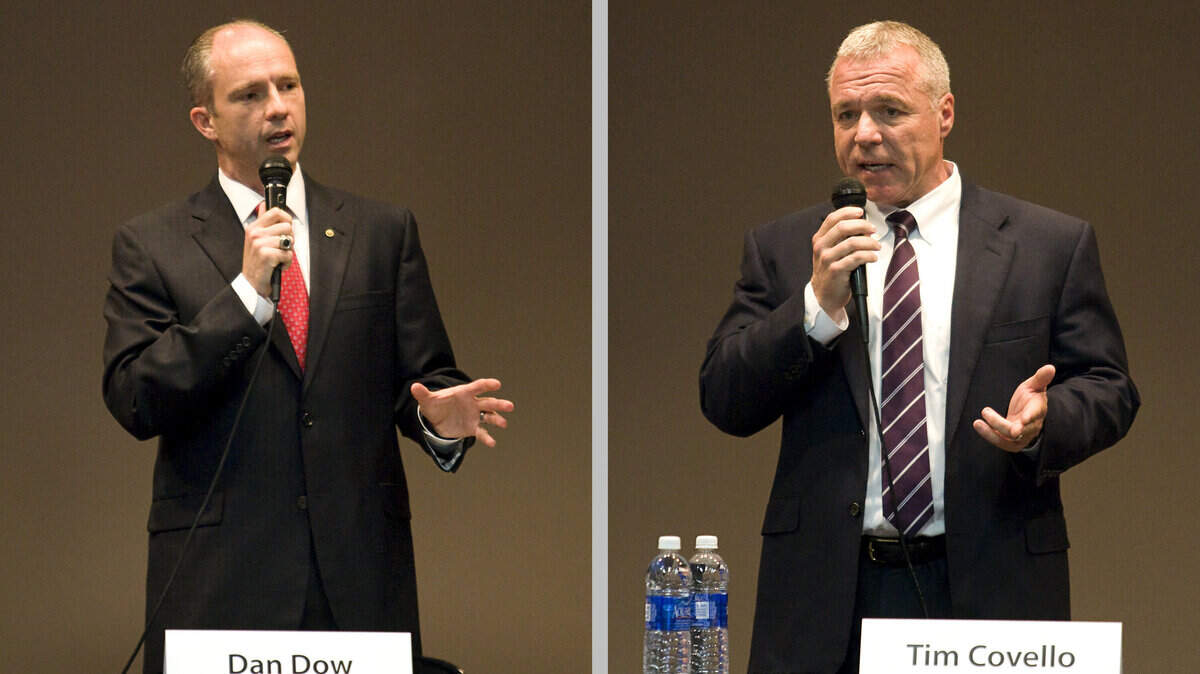 Dan Dow, left, and Tim Covello make their opening statements during a recent public forum for the district attorney candidates at the San Luis Obispo City/County Library.