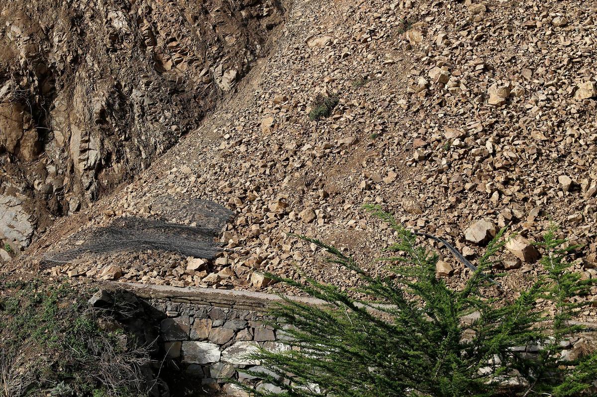 Mesh was unable to contain a rock slide that slipped onto Highway 1 at Polar Star, about a mile south of Ragged Point, seen here on Jan. 5, 2023.
