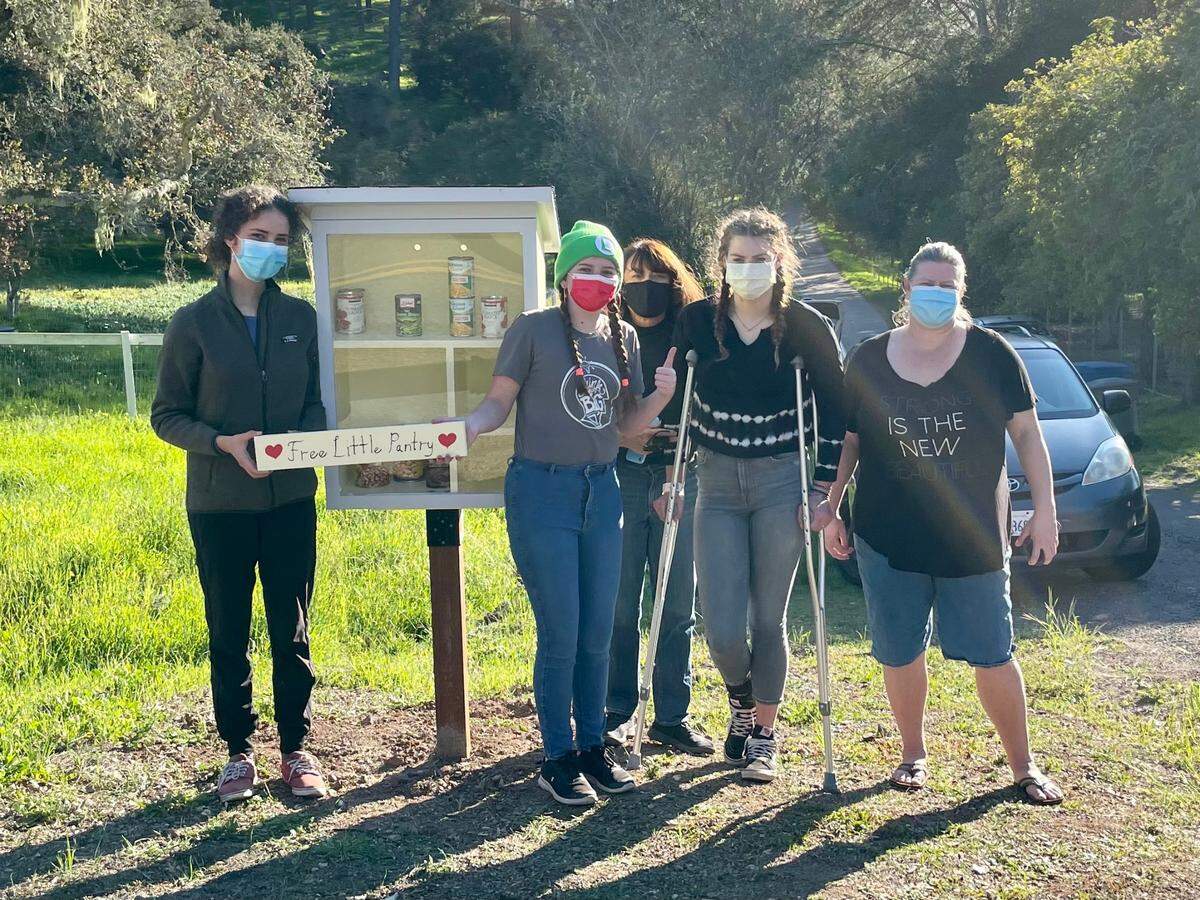 The first Little Free Pantry in Arroyo Grande is up and running at 815 Printz Road thanks to a local Girl Scout troop. Pictured above (from left) are troop members Sequoia Friedman and Violet Foronjy, homeowner Marilyn Rossa, troop member Sidda Todd and mother Heather Todd.
