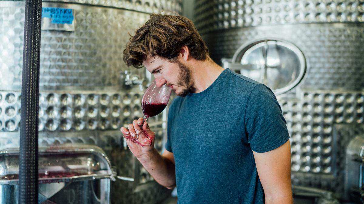 Drew Nenow, co-founder of Nenow Family Wines, tests the scent of a wine. Nenow is opening a new tasting room in Paso Robles on April 30, 2022.