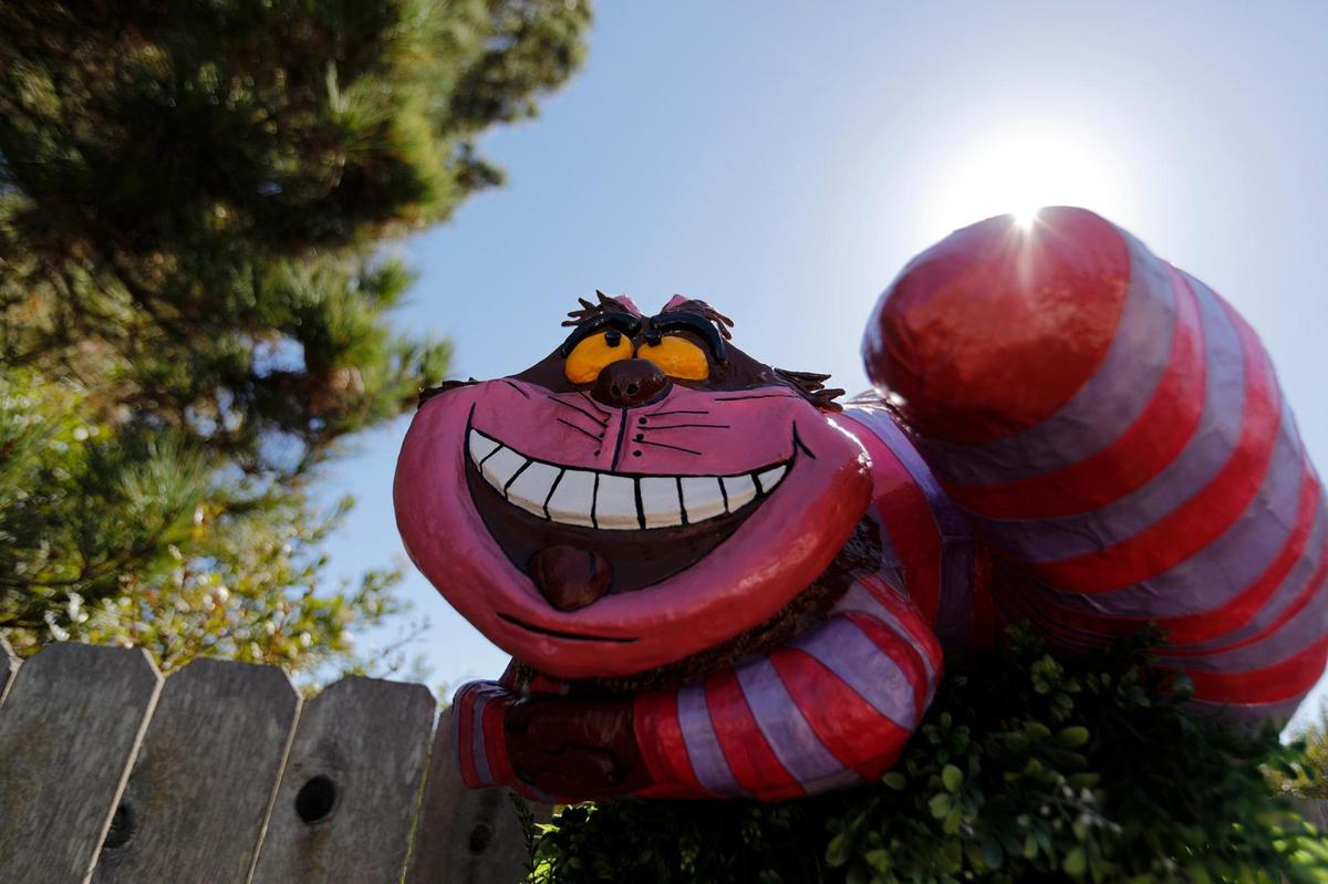 A Cheshire cat scarecrow is on display on the 1200 block of East Main Street in Cambria as part of the Cambria Scarecrow Festival in October 2022.