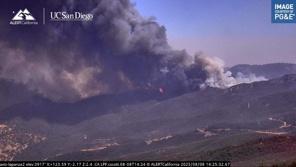 The Gifford Fire burns along a ridge line in a view from ALERTCalifornia’s La Panza 2 camera on Friday, Aug. 8, 2025.
