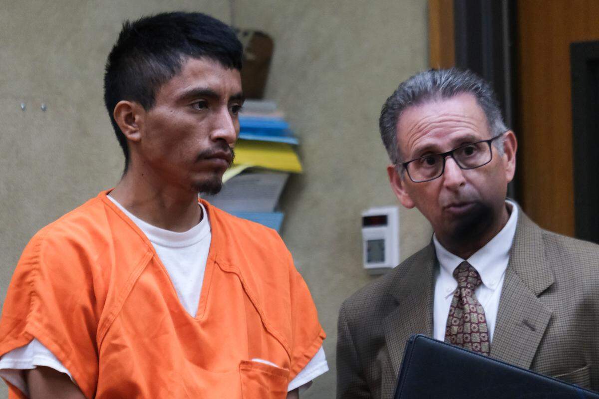 Sosimo Gonzalez De Jesus, left, attends his arraignment with a Spanish language interpreter in San Luis Obispo Superior Court on Oct. 11, 2024. He pleaded not guilty to rape of a minor under 14, assault with the intent to commit rape during a burglary and sending harmful material to a minor — all felonies.