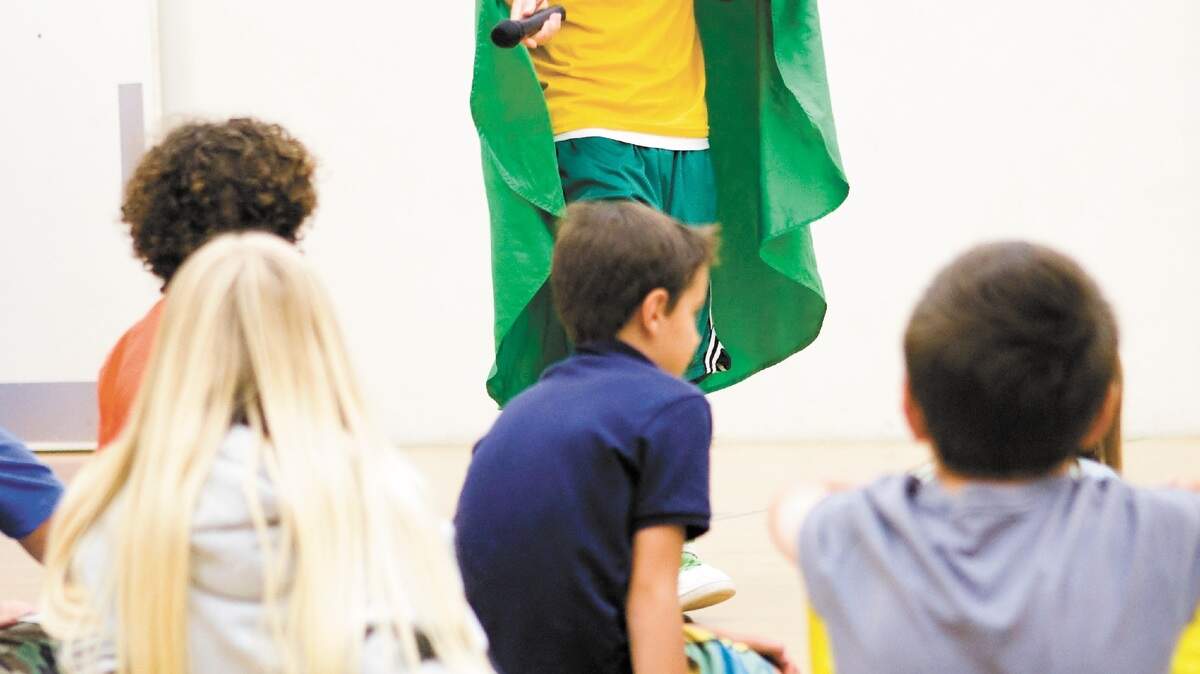 Environmental rapper and Cal Poly student Brett Edwards, aka Mr. Eco, performs his song ‘Reusable Bag’ on Wednesday as part of his show for kids at the YMCA in San Luis Obispo.