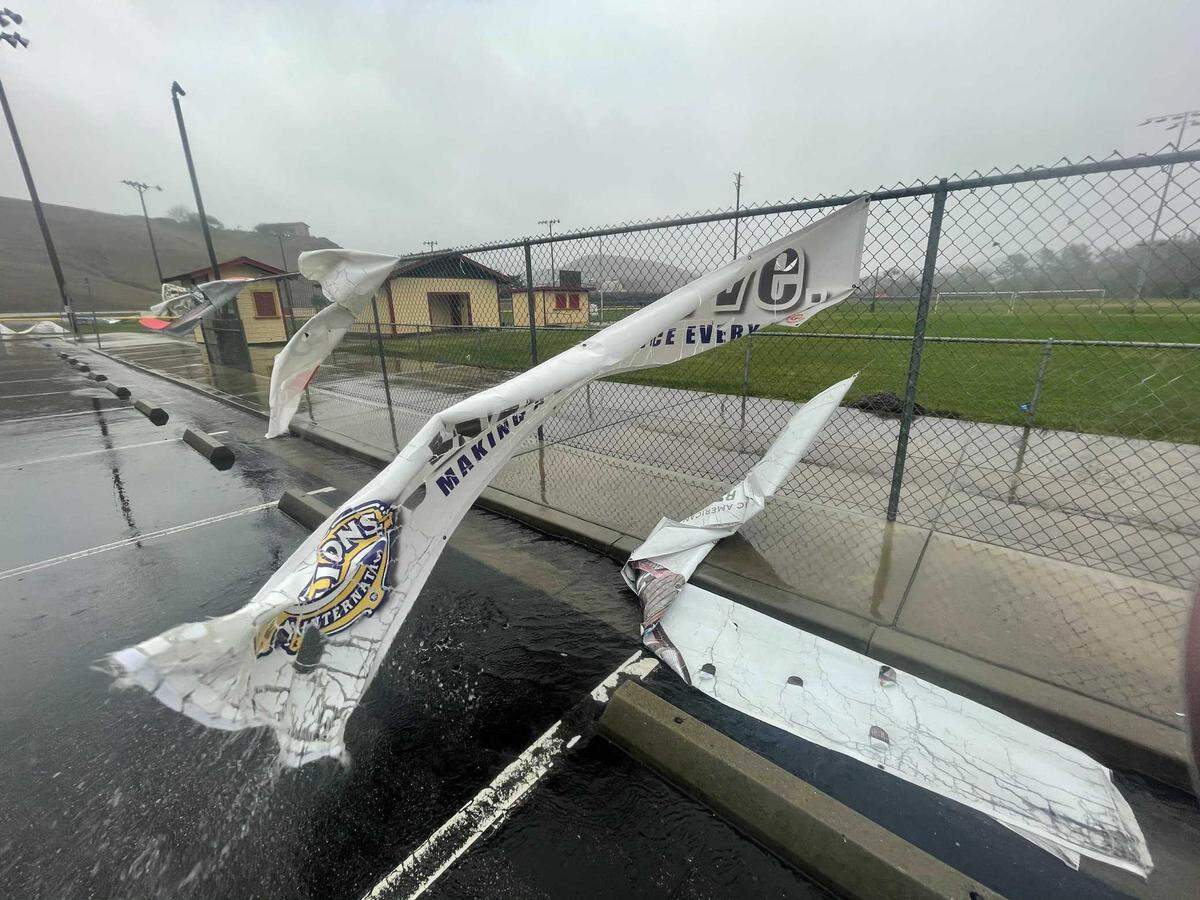 Banners at Leffingwell High School in Cambria were coming loose and waving in the wind
