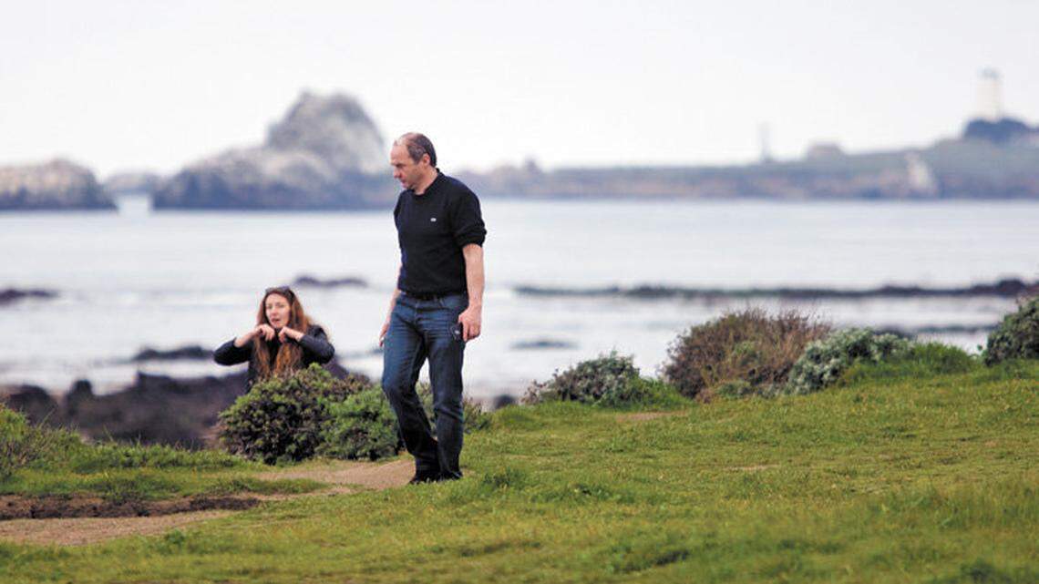 Mathilde Javelle and her father, Jean Michael Javelle, of France explore the bluffs near the Piedras Blancas Lighthouse. The area west of Highway 1 was preserved in a conservation easement agreement with Hearst Ranch.