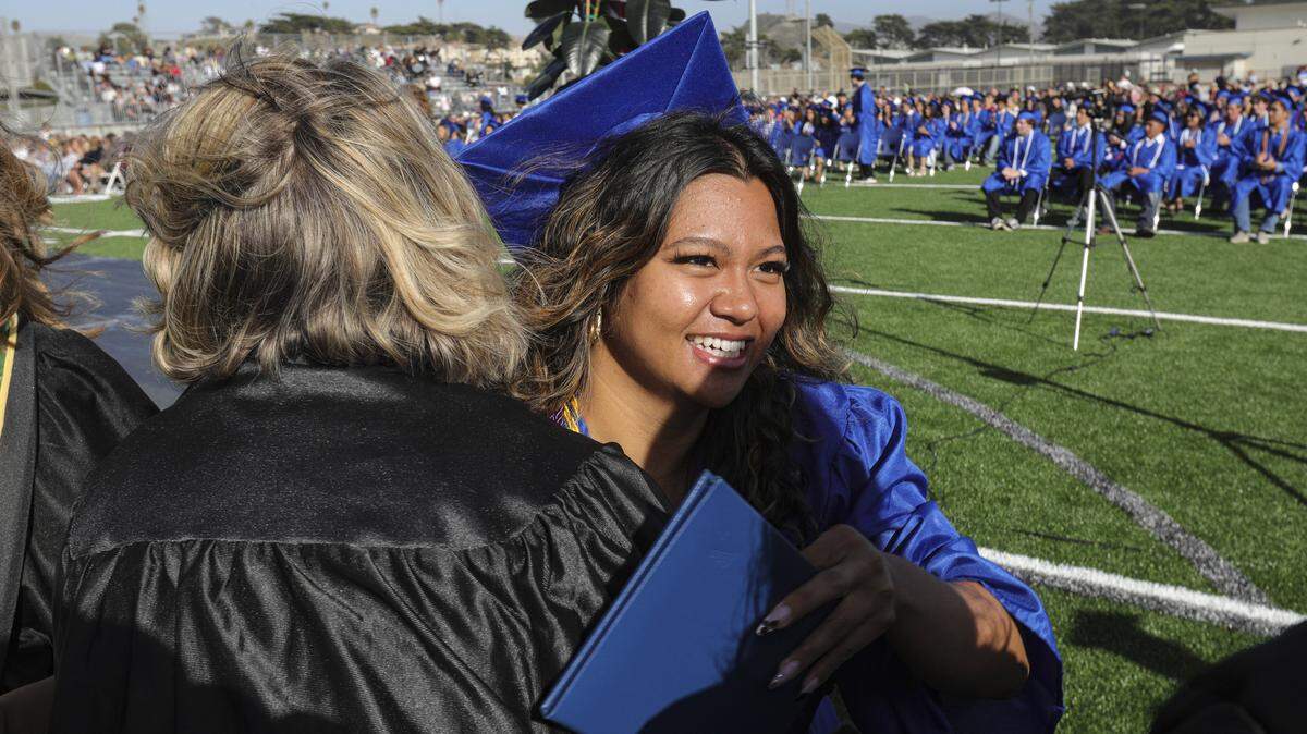 Jesica Coloma gets hugs from faculty. Morro Bay High School issued diplomas to 176 graduates on June 4, 2026.