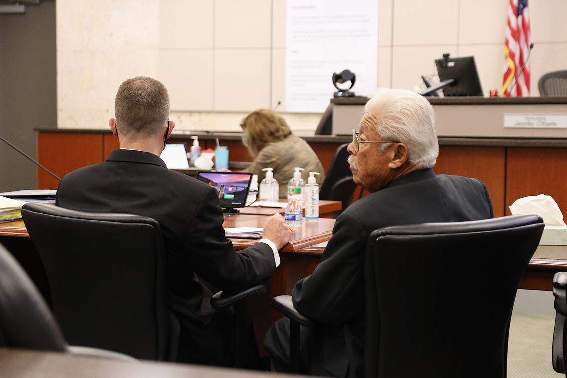 Paul Flores, left, and his father, Ruben Flores, sit in Monterey County Superior Court in Salinas on Sept 26, 2022. The two are on trial in connection with the 1996 murder of Kristin Smart.
