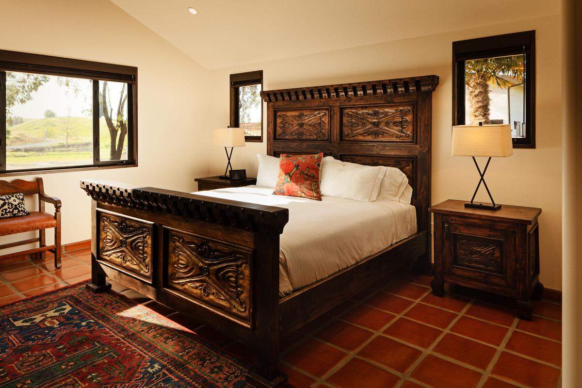 Hand-carved furniture, Saltillo tile floors and wool rugs are among the custom touches at La Lomita Ranch in San Luis Obispo.