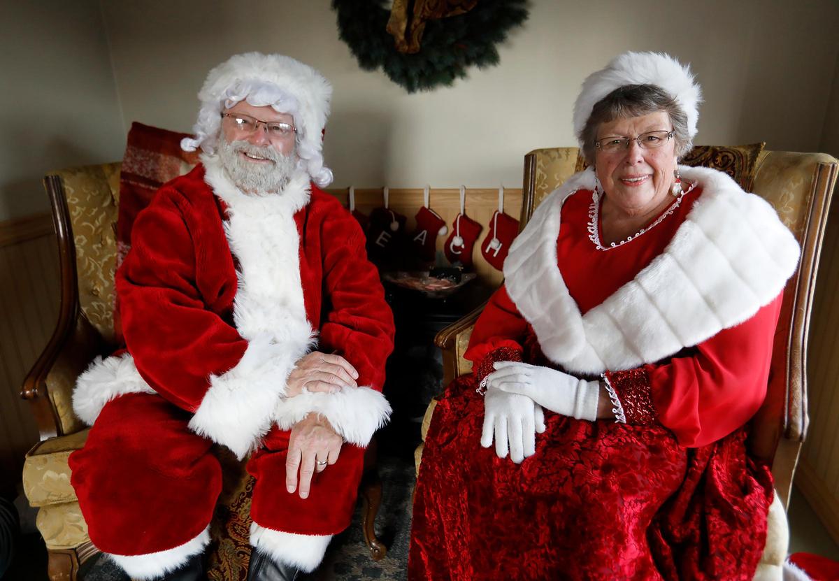 Husband-and-wife team Steve Geil and Della Carrillo stand in for Santa Claus and Mrs. Claus in Cayucos.