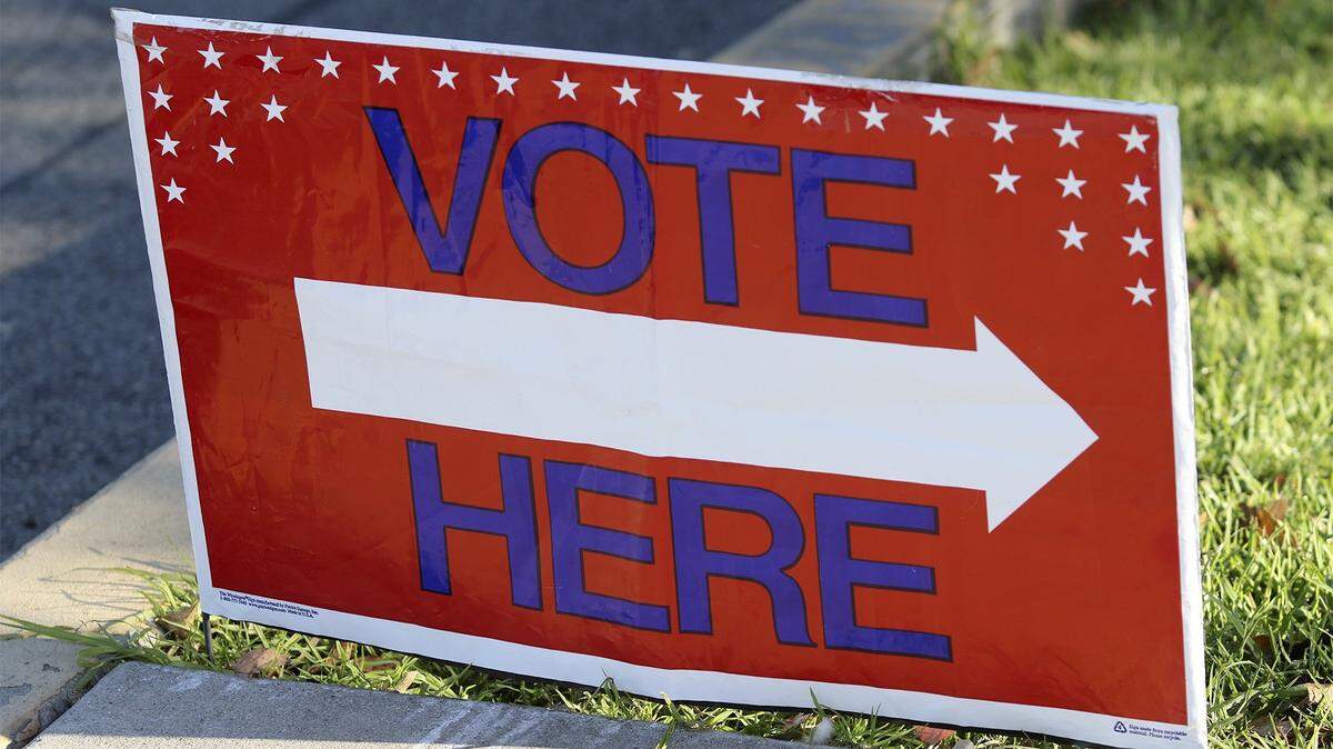 A sign showing voters where to cast their ballots.