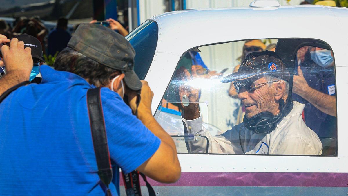 Harry Moyer, a veteran who flew fighter planes in World War II, celebrated his 100th birthday in the air with a solo flight from San Luis Obisopo County Regional Airport. He waves after completing preflight before takeoff.